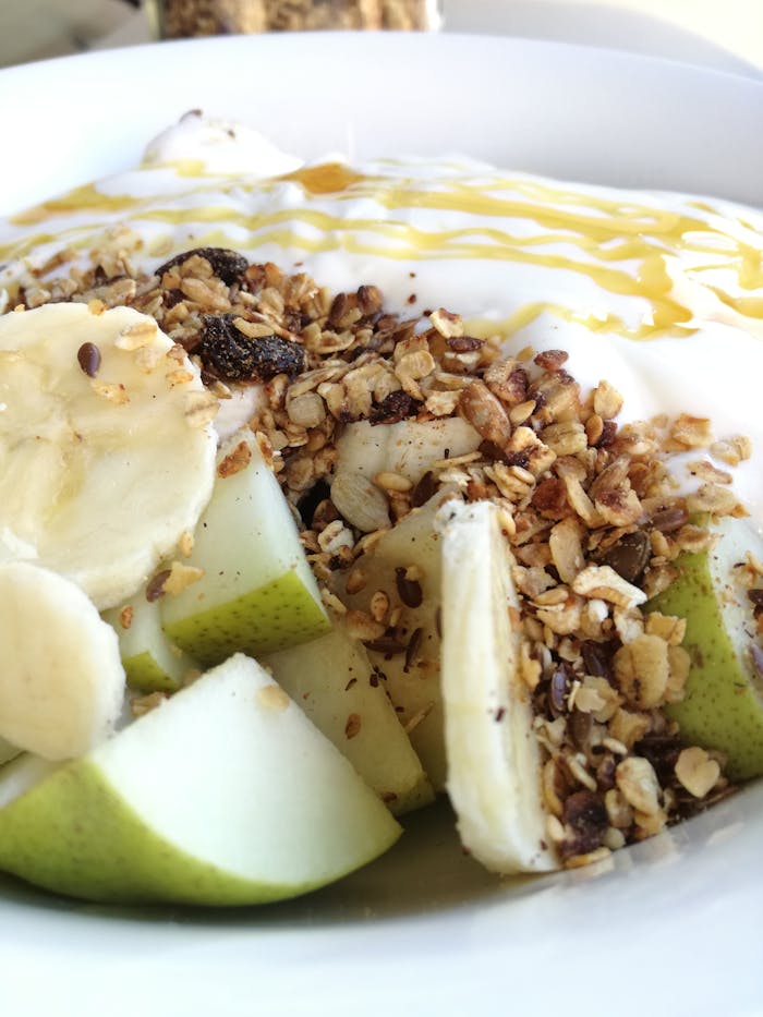 Close-up of a nutritious fruit and granola yogurt bowl, perfect for a healthy breakfast.